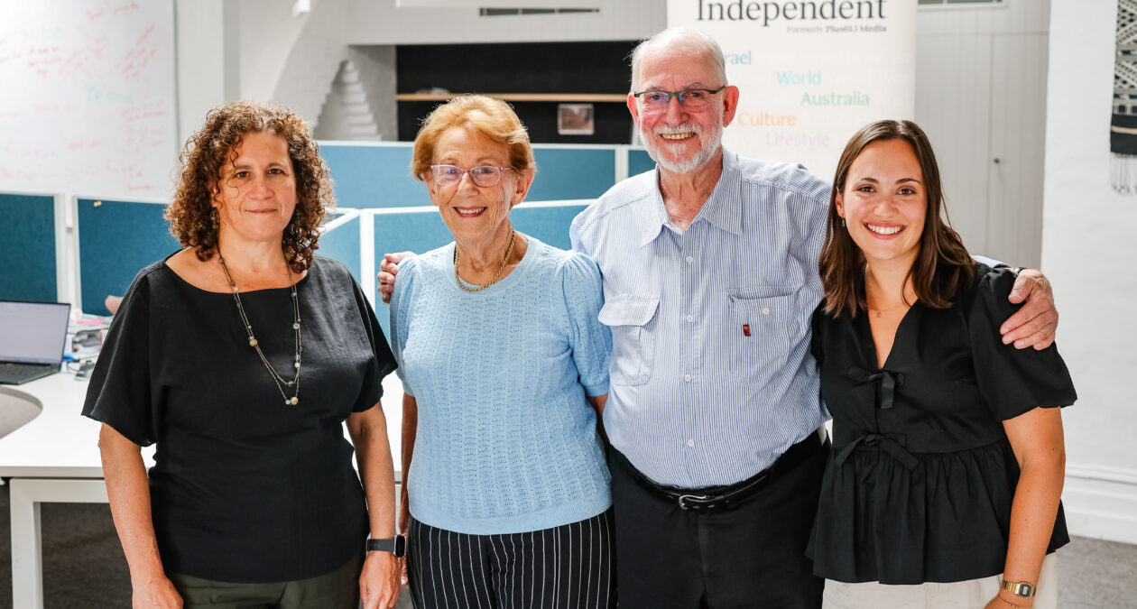Four people looking at the camera