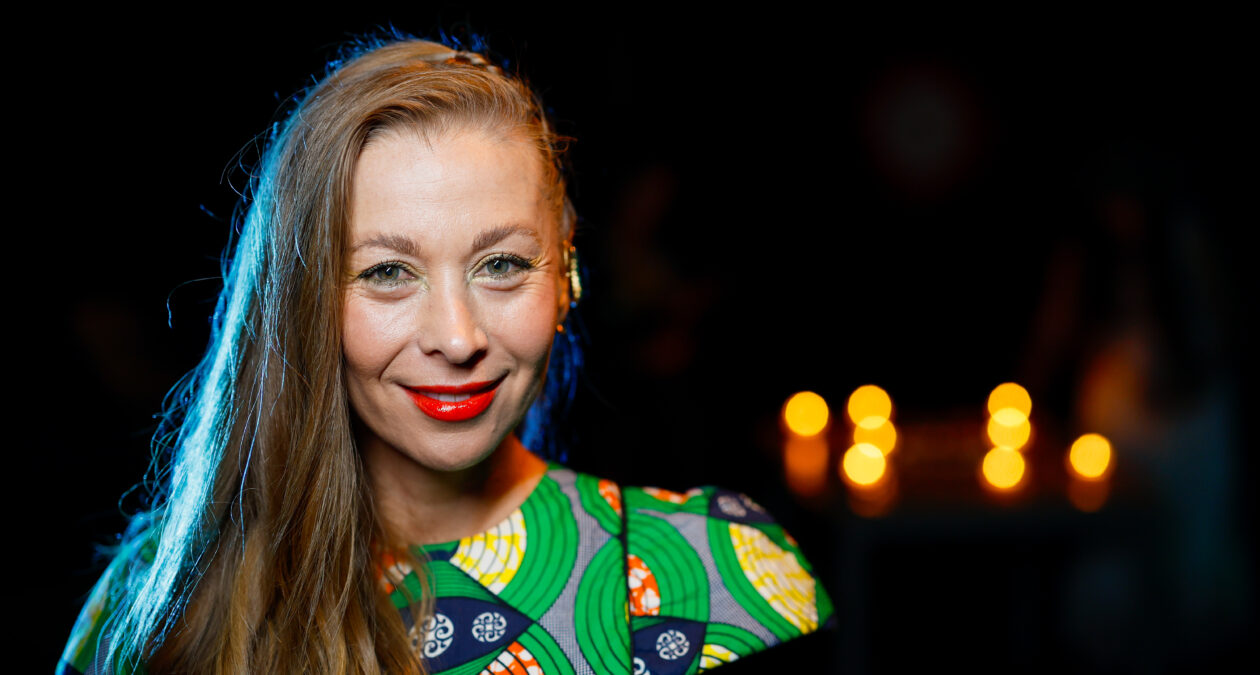 headshot of a woman in a great patterned dress
