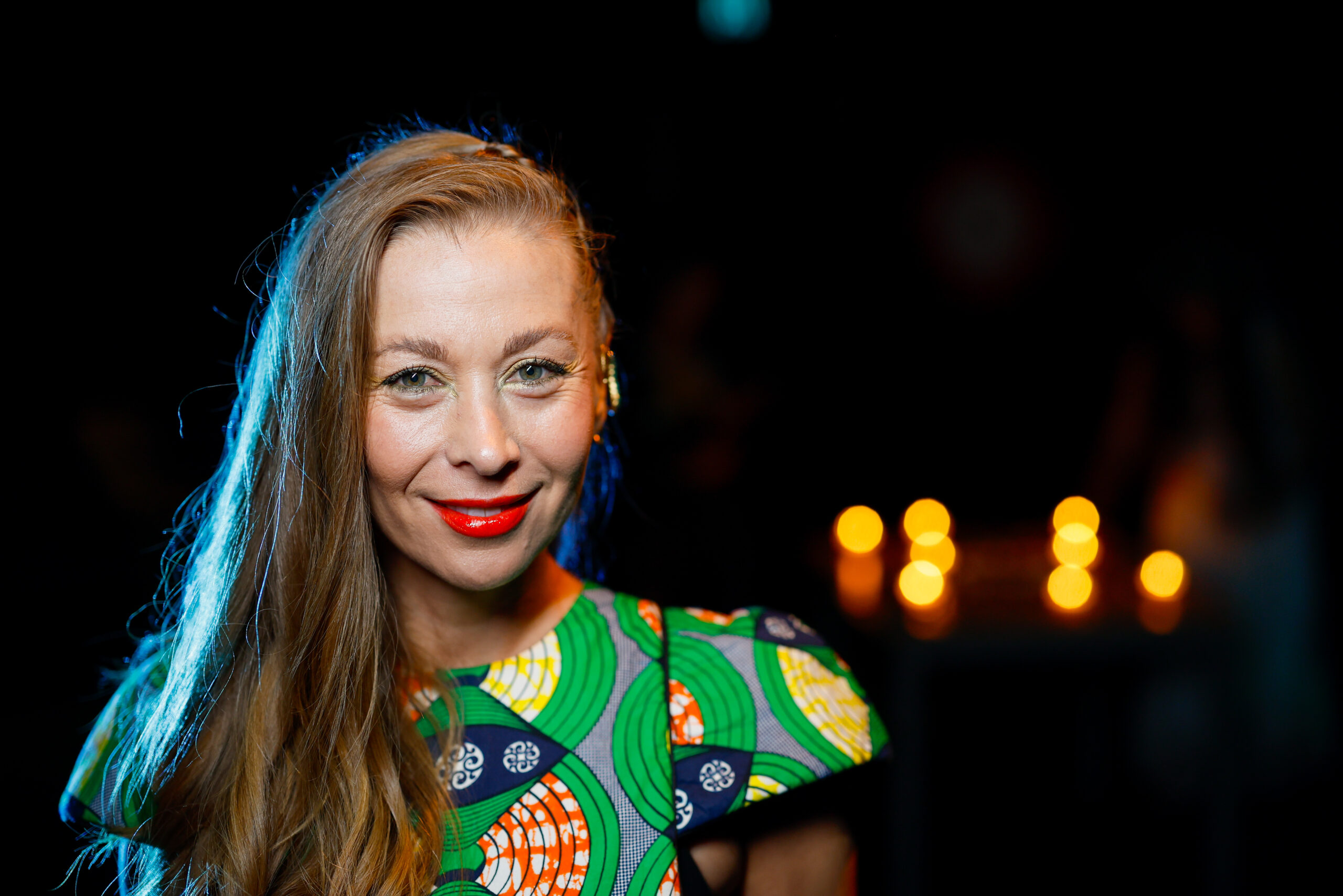 headshot of a woman in a great patterned dress