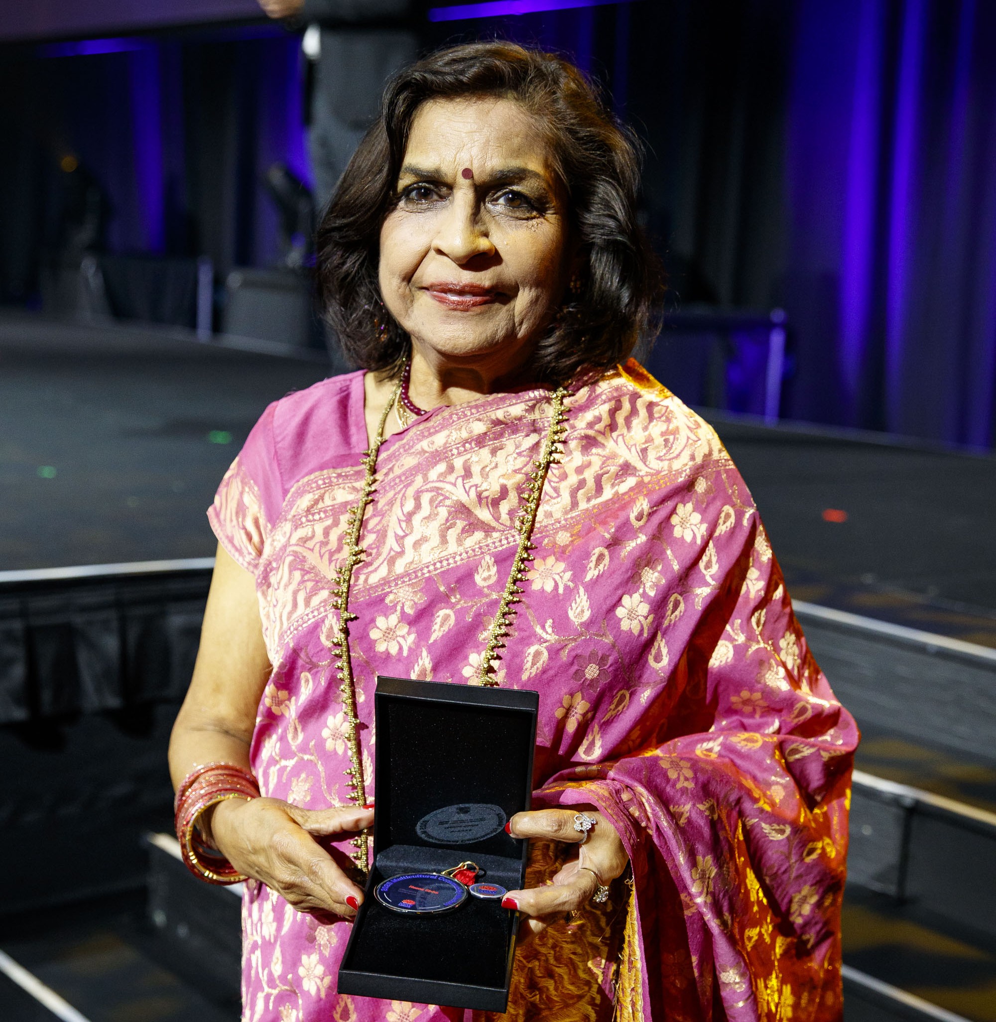 person holding a medal